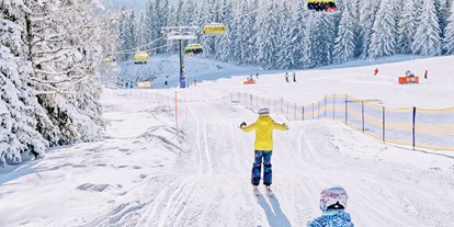 Skiregion - Après Ski im Skigebiet: Skihütten mit Après Ski - Salzburg - Am Ende des FilZoo der sich beim Sixpack befindet können die Kinder eine Wellenbahn erwarten - Skigebiet Filzmoos